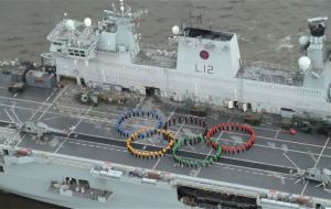 Servicemen on deck recreate the Olympic rings 