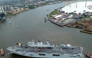 HMS Ocean squeezing through the Thames barrier