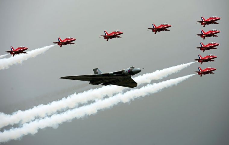 The Vulcan and the Red Arrows over fly the air show grounds 