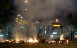 Hooded vandals set on fire public transport buses