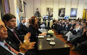 Cristina Fernandez making the announcement and defending her policy of restricting imports  