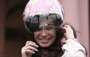 Cristina with her special colours helmet on making the announcement