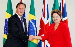 PM Cameron and President Rousseff shake hands at the Planalto Palace
