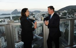 Petrobras president Graça Foster and PM Cameron with the background of Rio 