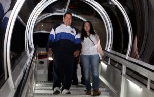 The Venezuelan leader unaided walks down the steps from the plane that brought him from Havana  