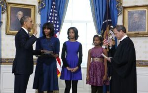 Obama taking the presidential oath at the Blue Room with his family