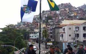 The flags of Brazil and Rio flying after the favela were taken back to government control 