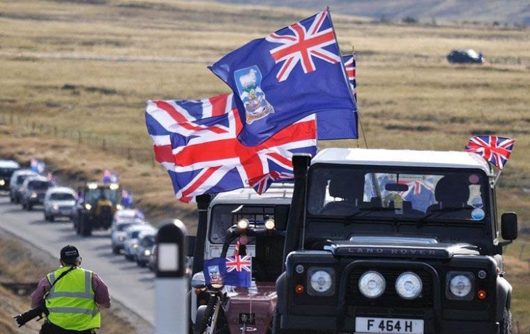 Falkland Islanders in a massive concentration displaying the Union Jack  (Photo: M. Short)