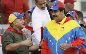 Maduro in his Venezuelan flag colours shirt and Diosdado Cabello (L), both had important announcements to make (Pic. AP)