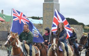 Keeping with tradition horse riders march by the Liberation memorial (Pic: G. Short)