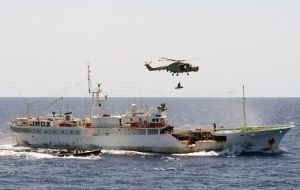 HMS Argyll Lynx helicopter winching the injured fisherman from the trawler 