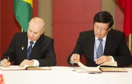 Guido Mantega and  Lou Jiwei of China signed the ambitious agreement 