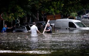 Whole neighbourhoods have been flooded and people move around in inflatable dinghies and surf boards