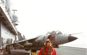 BBC correspondent Briley in a Royal Navy survival suit on an aircraft carrier in Falklands waters