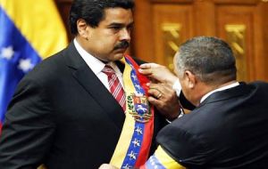 Maduro with the presidential sash and National Assembly president Diosdado Cabello