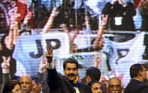 Maduro addressing the crowd at a stadium packed with Argentine government militants 