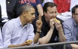 Sharing a hot dog with President Obama at a basketball game during Cameron’s last visit 