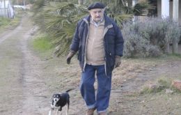 Mujica in his farm house in the outskirts of Montevideo with his three legged pet ‘Manuela’