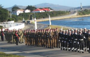 In a beautiful sunny morning the forces parade along Ross Road 