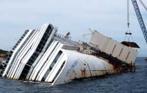 The cruise vessel in being recovered from the rocks where she remains