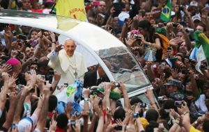 Again from the pope-mobile, mingling with the people, kissing babies and smiling all the time