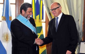 Saint Vincent and Grenadines Ralph Gonsalves is greeted by Argentine minister Timerman