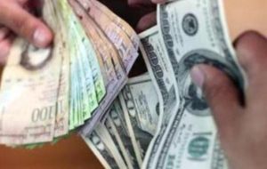Travelers can access dollars at the official rate of 6.3 bolivars per dollar, which on the black market can fetch about seven times the official rate. 