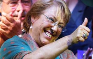Presidential candidate and former President Michelle Bachelet gives the thumbs up sign during a victory rally in Santiago, Chile, Sunday, Dec. 15, 2013. 