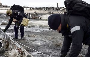 Image shows members of the Ships Company measuring a lattice mast, to include these statistics within the report.