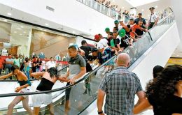 Thousands of peaceful youths gather in shopping malls affecting retailers and sales 