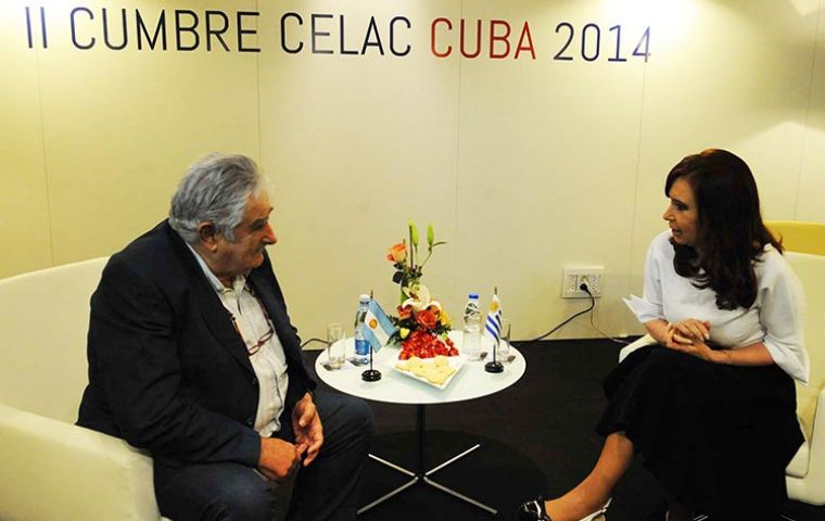The Uruguayan president with Cristina Fernandez in Cuba