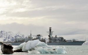 The Type 23 frigate sailing among icy landscape in the extreme south Atlantic