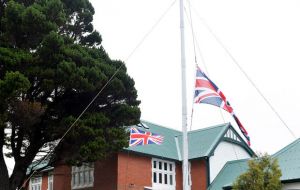 Recreation of the raising of the British standard outside Government House  