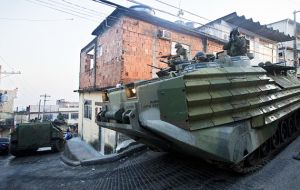 Marines in armored cars helped to reestablish police control, but drug dealers managed to slip out  (Pic AP)