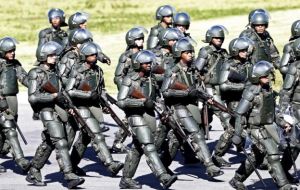 The Brazilian foot police have been equipped with sets of 'Rob-Cop' armor to contain protests  (Pic AP)