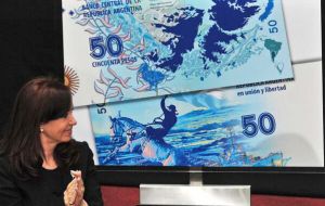 CFK unabashedly unveiling a new currency note (50 pesos) featuring the map of the Falkland Islands in Argentina's colors