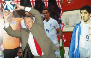 Former Head of Falklands Radio Patrick Watts MBE, a guest at the British Embassy reception, takes advantage of the Uruguay – England World Cup build-up with a photographic ´save`.   