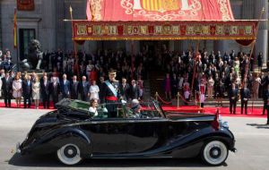 After the ceremony the king rode in an open Rolls Royce through central Madrid with his wife, Queen Letizia