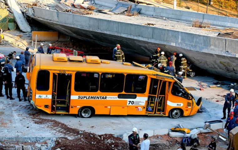 Two people were killed, at least 23 injured and several vehicles crushed by the collapsing tons of concrete