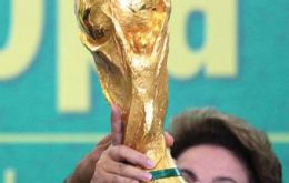 Dilma together with Putin and Zuma will be handing the World Cup to the winner. Putin since Russia hosts the next Cup in 2018 and Zuma because in 2010 it was played South Africa   