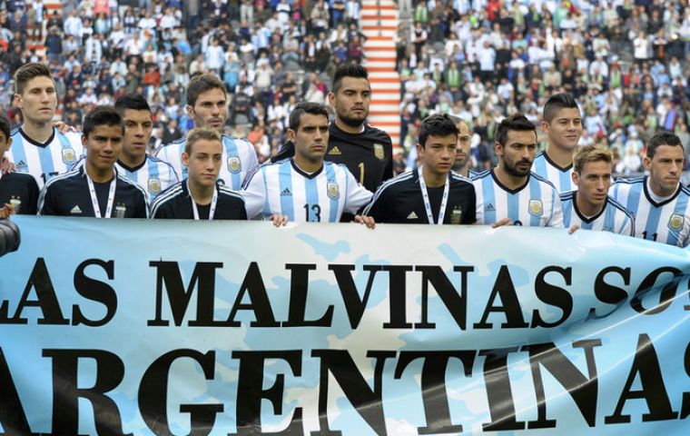 'Las Malvinas son Argentinas', before kick-off in a friendly against Slovenia in La Plata on June 7.