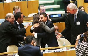 U.N. representatives for Venezuela, including Foreign Minister Rafael Ramirez, right, celebrate after being elected to a two year term as a non-permanent member of the United Nations Security Council 