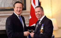 PM Cameron in Downing Street hands the medals to the veterans (Pic PA)