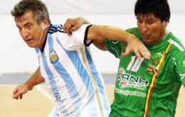 ”Bolivian president Evo Morales and Governor Sergio Urribarri sport their national football teams' jerseys in a friendly match in Parana.