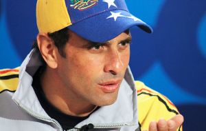 “With one day of the year left, they publish inflation figures. The highest in the world. Wonderful,” scoffed opposition leader Capriles