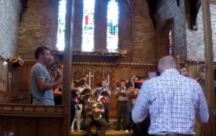 The Royal Marines band practicing the musical composition at Stanley's Cathedral