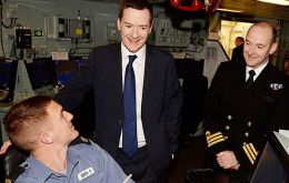 At Portsmouth Naval Base the Chancellor was given a tour of the waterfront to see where the new Queen Elizabeth-class carriers will be based
