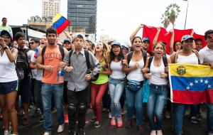 In Caracas, dozens of opposition supporters rallied at the Interior Ministry and marched to the Vatican envoy's office.