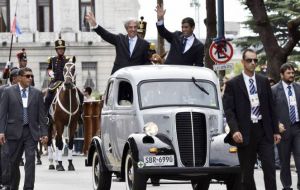 Vazquez and vice-president Sendic in the Fordson van are applauded and cheered by the crowd as they are driven to Independence Plaza 