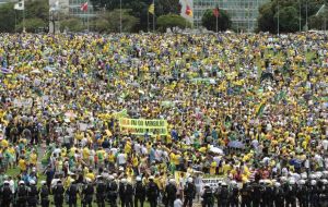 In Sao Paulo more than a million people, according to state police, weathered a drizzle to march along the heart of Brazil's financial capital and biggest city by late afternoon Sunday.